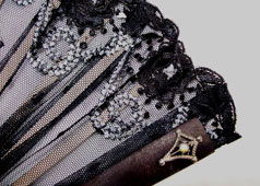 vintage embroidered black lace fan with jewels close up